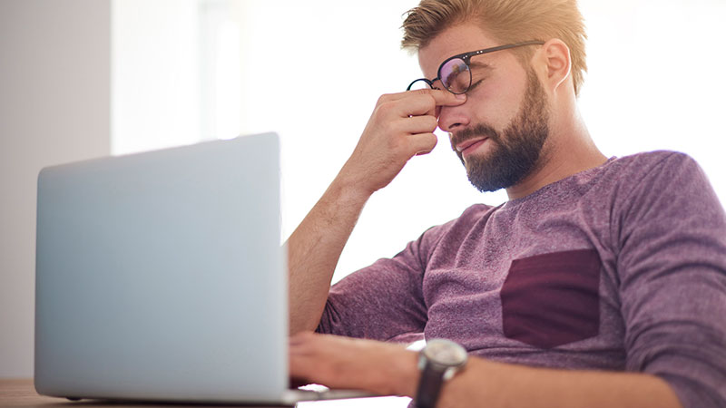 stressed_out_man_laptop_headache